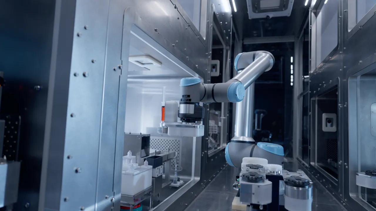 Robotic arm holding syringe with precision