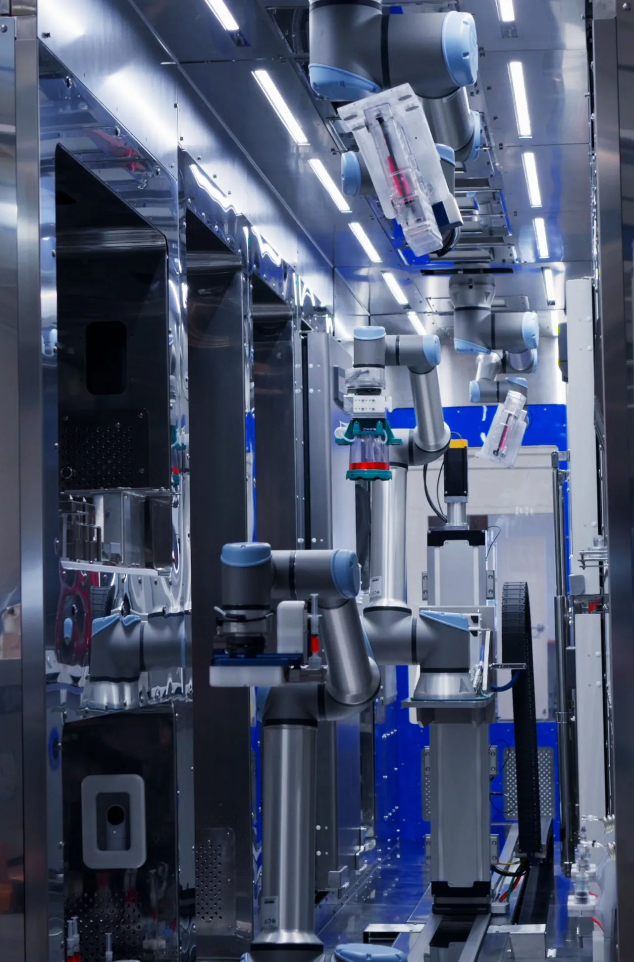 Four robotic arms operating in parallel inside a Multiply Labs cluster