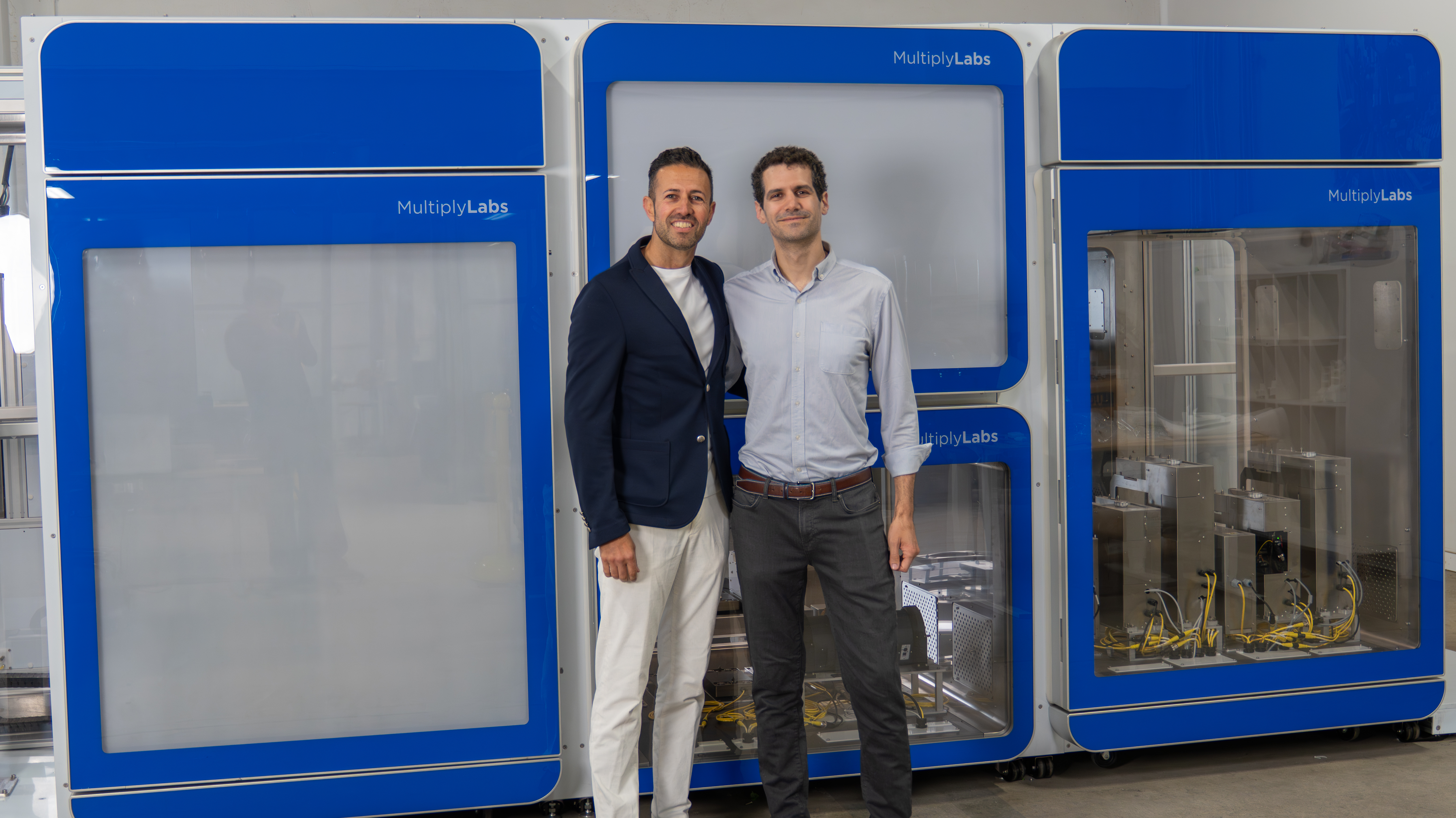 Enrico Racca and Fred Parietti in front of a Multiply Labs prototype cluster